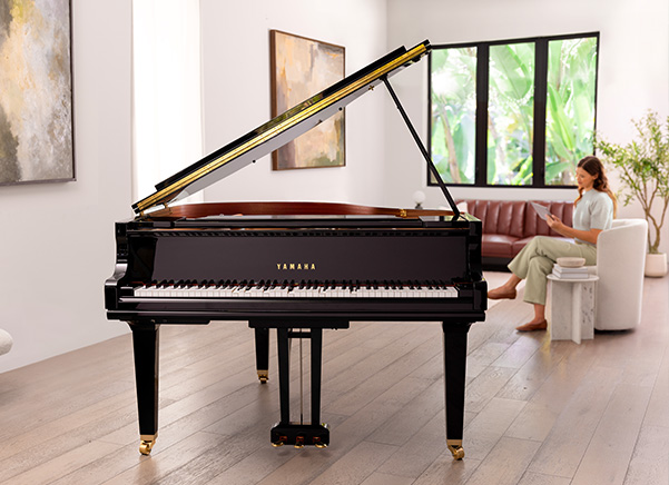 Yamaha GCB polished ebony baby grand piano with its elegant cabinet and lid open