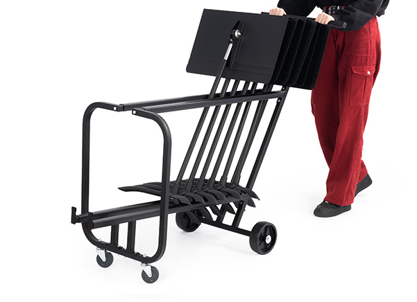 Person pushing Symphony stand cart with stands in it