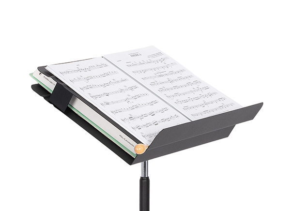 Scores in the stand compartment and music open on desk with conductors baton