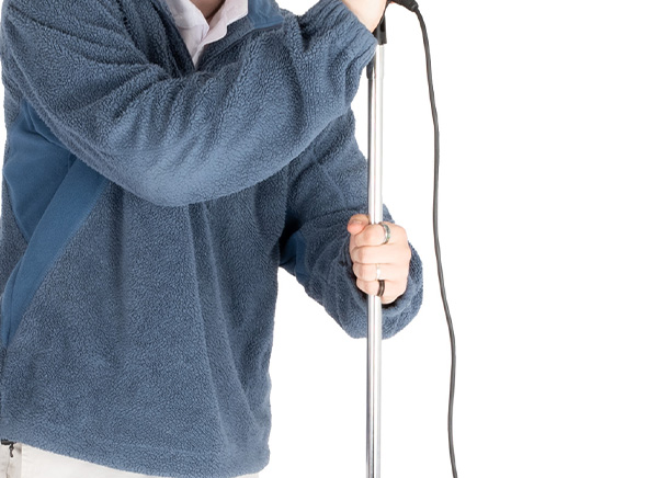 Person adjusting music stand height