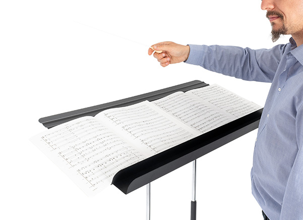 Close up of the extra wide desk with 4 sheets of music side by side
