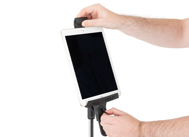 Person placing tablet inside the tablet stand